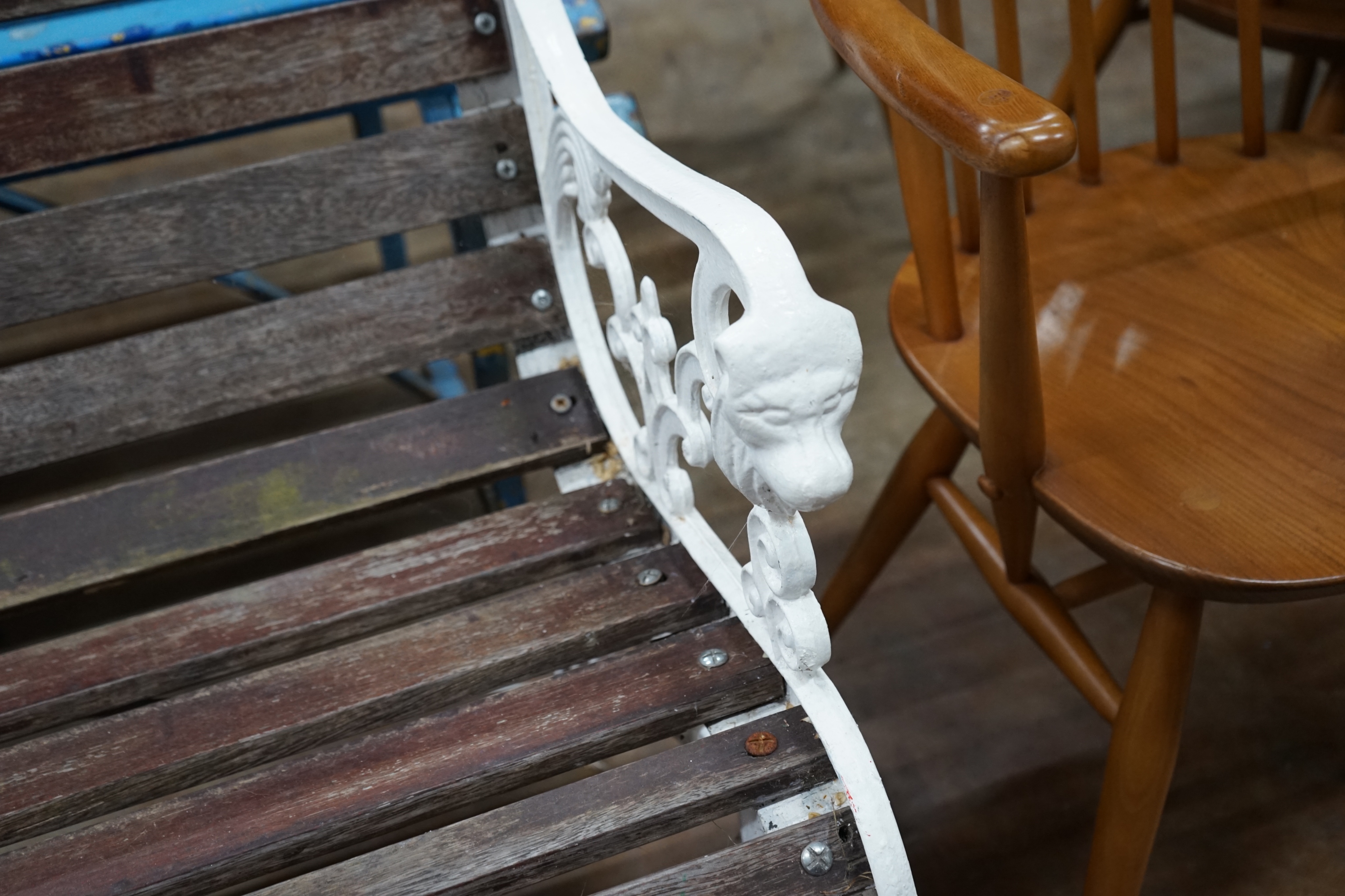 A Victorian style painted slatted wood garden bench, length 117cm width 60cm height 78cm